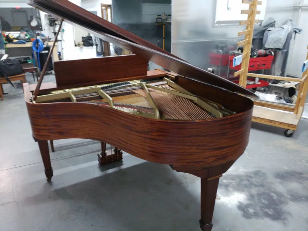 The tail of a grand piano that has been fully rebuilt in the St. Louis Pianoworks shop